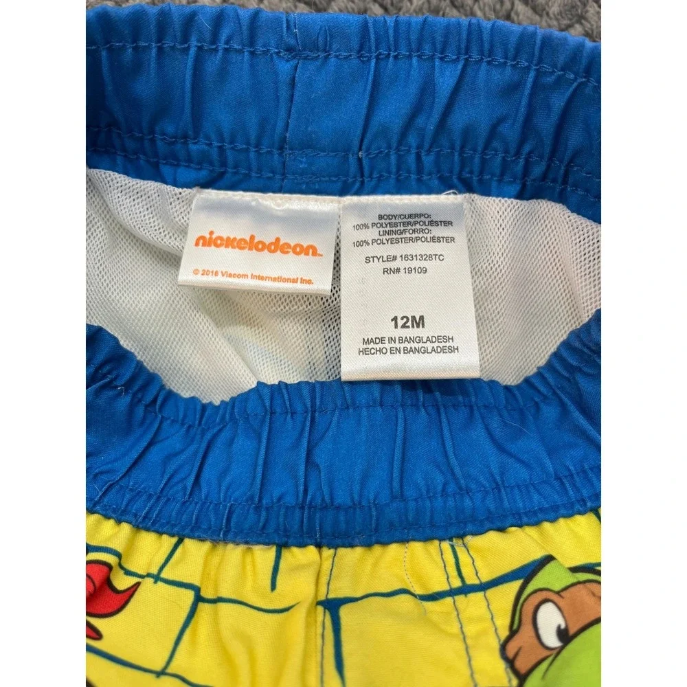 TMNT Shell Up Boys Blue Yellow Nickelodeon Swim Trunks Graphic Mesh Lined 12M